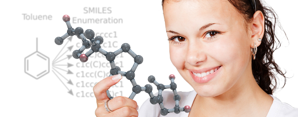 Girl smiling and holding molecule